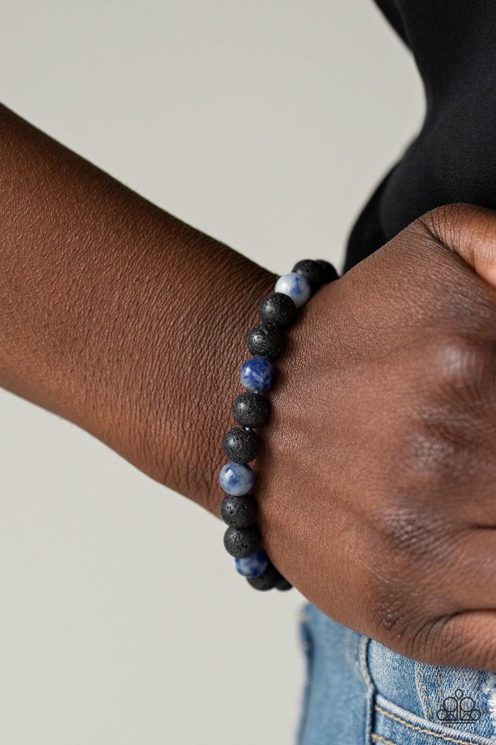 Paparazzi Accessories Top Ten Zen - Blue A collection of black lava rock and tranquil blue stone beads are threaded along a stretchy band around the wrist for a seasonal look. Jewelry