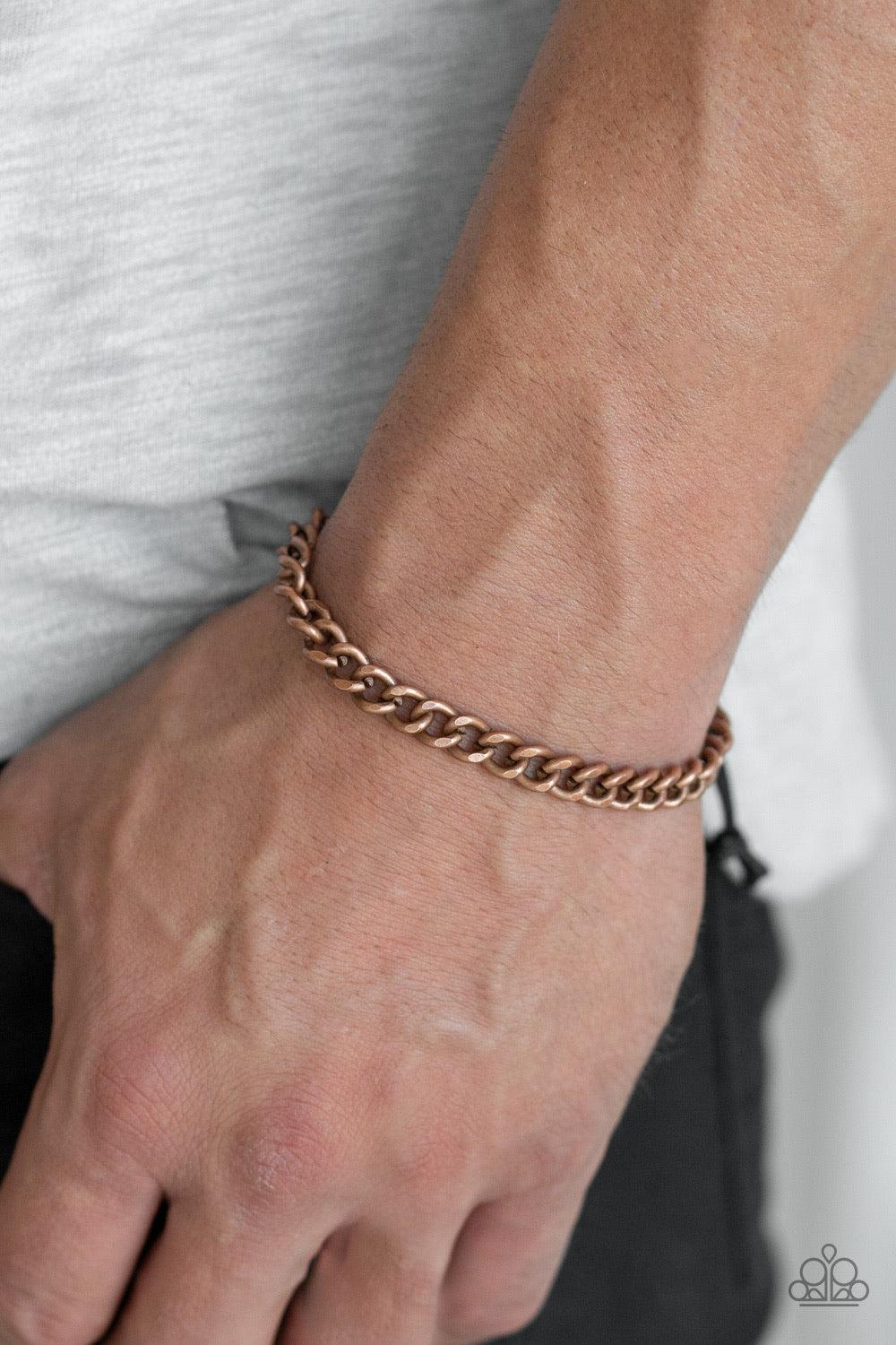 Paparazzi Accessories Goal! - Copper Shiny black cording knots around the ends of a copper beveled cable chain that is wrapped across the top of the wrist for a versatile look. Features an adjustable sliding knot closure. Jewelry