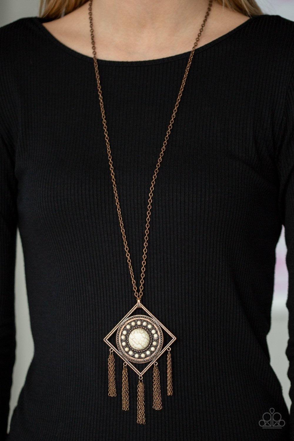 Paparazzi Accessories Sandstone Solstice - Copper Radiating with studded details and refreshing white stones, a round frame is nestled inside of an airy copper square for a tribal inspired look. Attached to a lengthened copper chain, the colorful stone pe