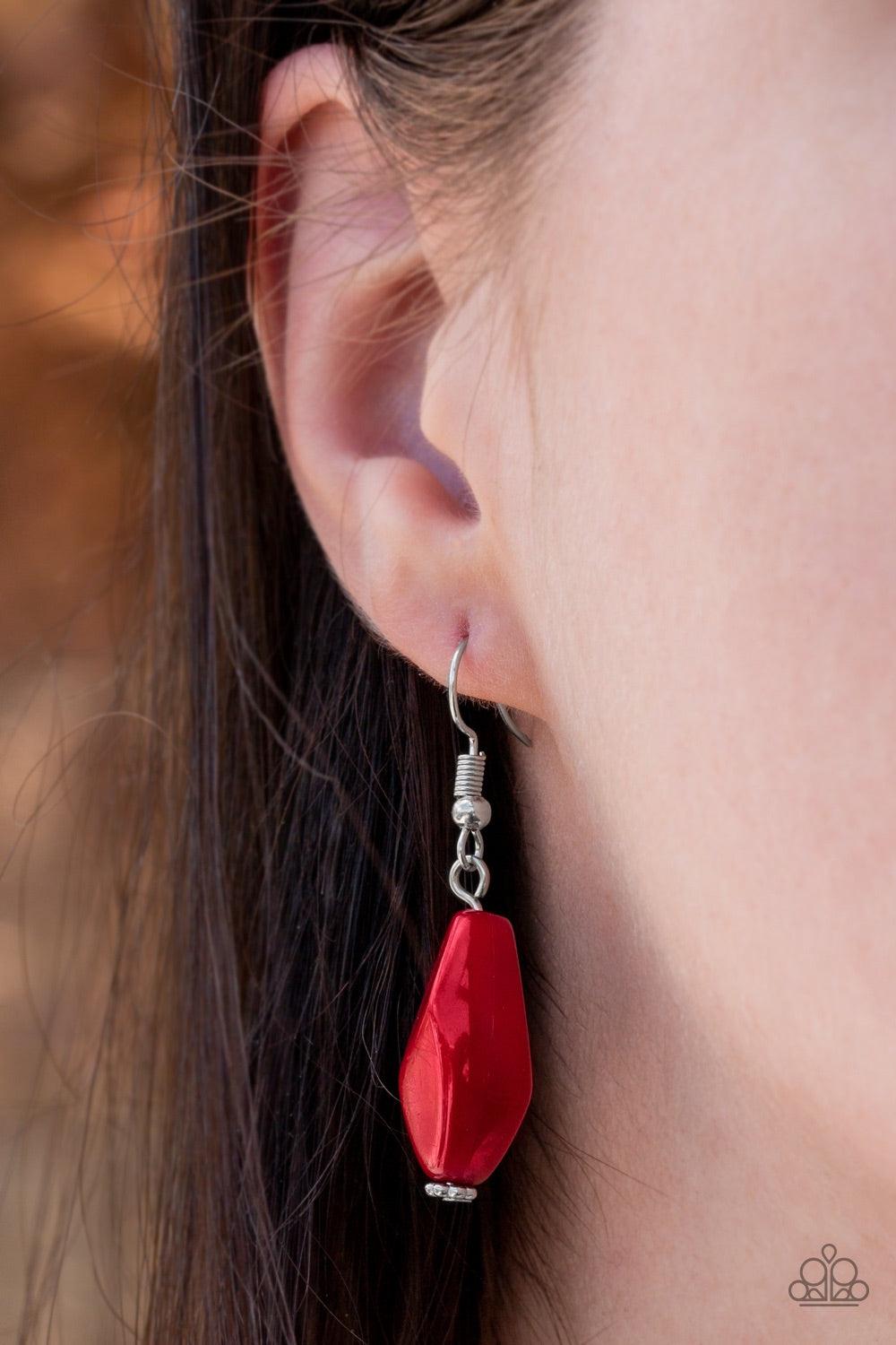 Paparazzi Accessories Royal Retreat - Red Featuring the robust shade of Wine, faceted, opaque, and crystal-like beads swing from two rows of silver chains, creating vivacious layers below the collar. Features an adjustable clasp closure. Jewelry