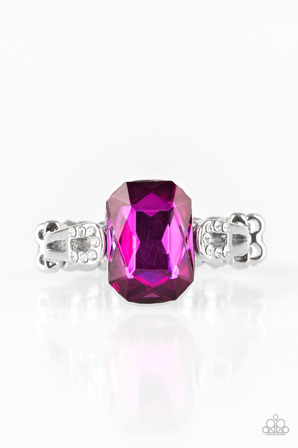 Paparazzi Accessories Feast Your Eyes - Pink Featuring a regal emerald style cut, a glittery pink gem is pressed into a dainty silver band dusted in glassy white rhinestones for a refined finish. Features a dainty stretchy band. Jewelry