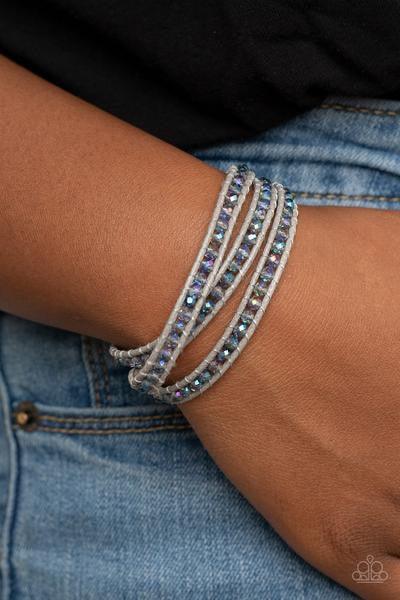 Paparazzi Accessories What Goes Around - Multi A dainty collection of iridescent crystal-like beads are delicately threaded between two strands of shiny gray cording, coalescing into a trendy double wrap bracelet around the wrist. Features an adjustable b