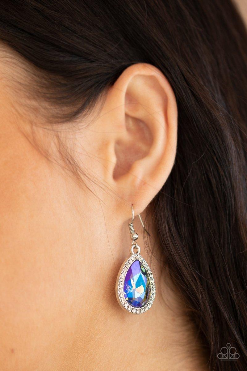 Paparazzi Accessories Dripping with Drama - Multi An iridescent teardrop gem is pressed into the center of a silver teardrop frame encrusted in glassy white rhinestones, creating dramatic sparkle. Earring attaches to a standard fishhook fitting. Sold as o