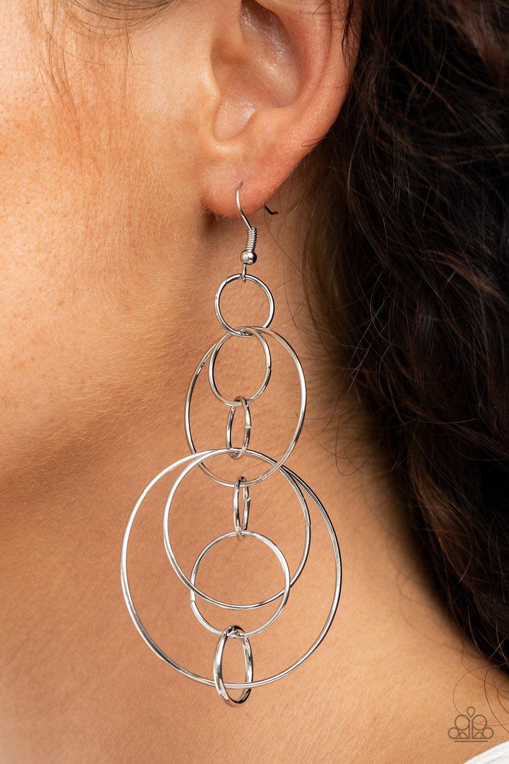 Paparazzi Accessories Running Circles Around You - Silver Small and medium sized silver links delicately alternate into an airy chain, while larger silver hoops haphazardly connect the chain into a dizzying lure. Earring attaches to a standard fishhook fi