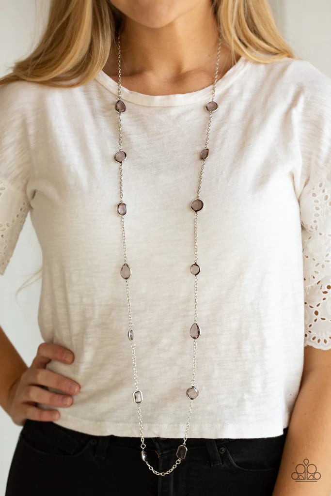 Paparazzi Accessories Glassy Glamorous - Silver Featuring sleek silver fittings, an array of glassy smoky gemstones trickle along a shimmery silver chain for a glamorous look. Features an adjustable clasp closure. Sold as one individual necklace. Includes