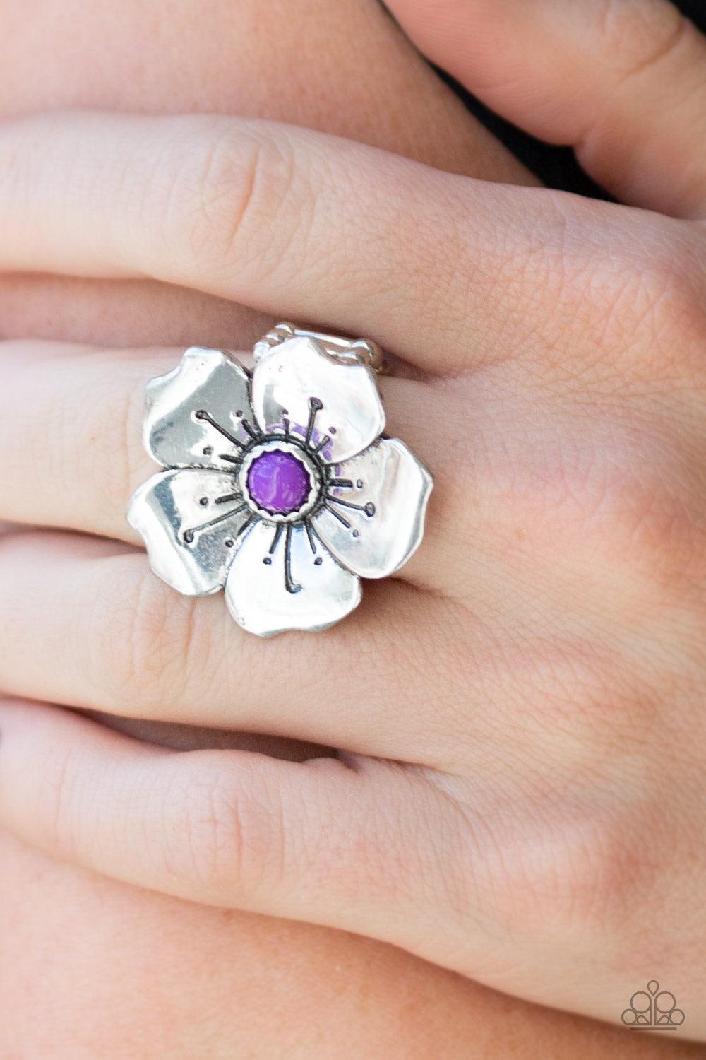 Paparazzi Accessories Boho Blossom - Purple A bright purple bead is pressed into the center of a blooming silver flower radiating with antiqued details for a whimsical look. Features a stretchy band for a flexible fit. Sold as one individual ring. Jewelry