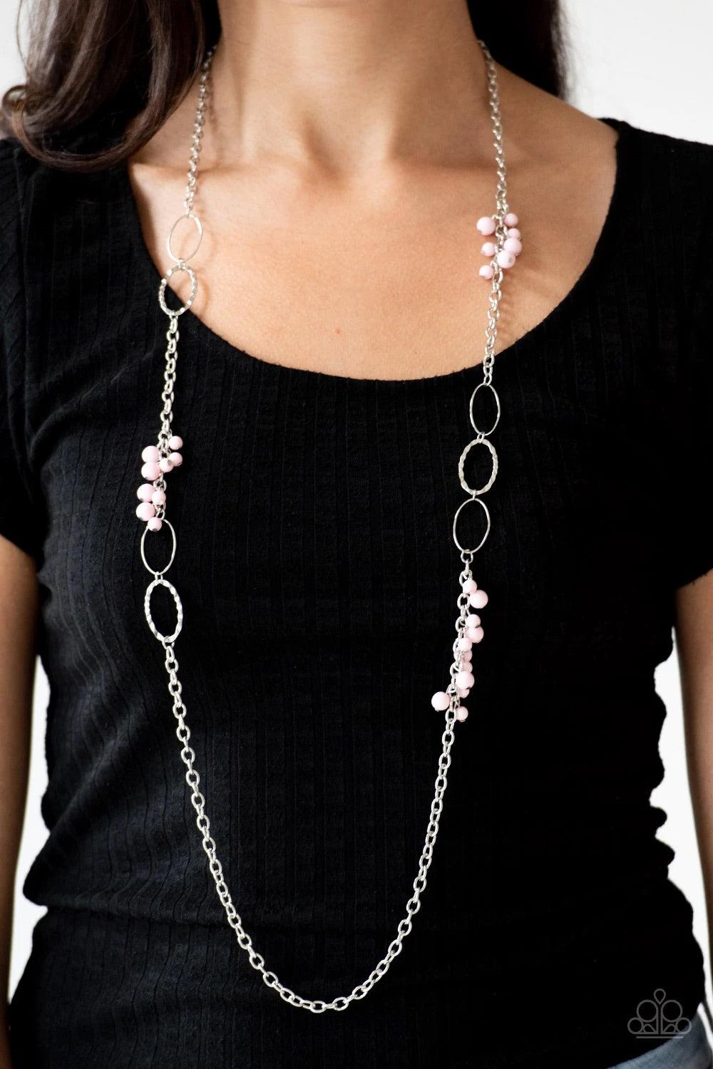 Paparazzi Accessories Flirty Foxtrot - Pink Smooth and hammered silver rings join clusters of shiny pink beads along a shimmery silver chain for a colorful look. Features an adjustable clasp closure. Sold as one individual necklace. Includes one pair of m