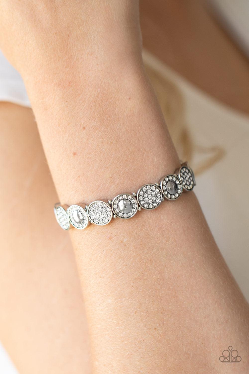 Paparazzi Accessories Glamour Garden - White Encrusted in dainty white rhinestones, mismatched silver frames are threaded along stretchy bands around the wrist for a sparkly look. Sold as one individual bracelet. Jewelry