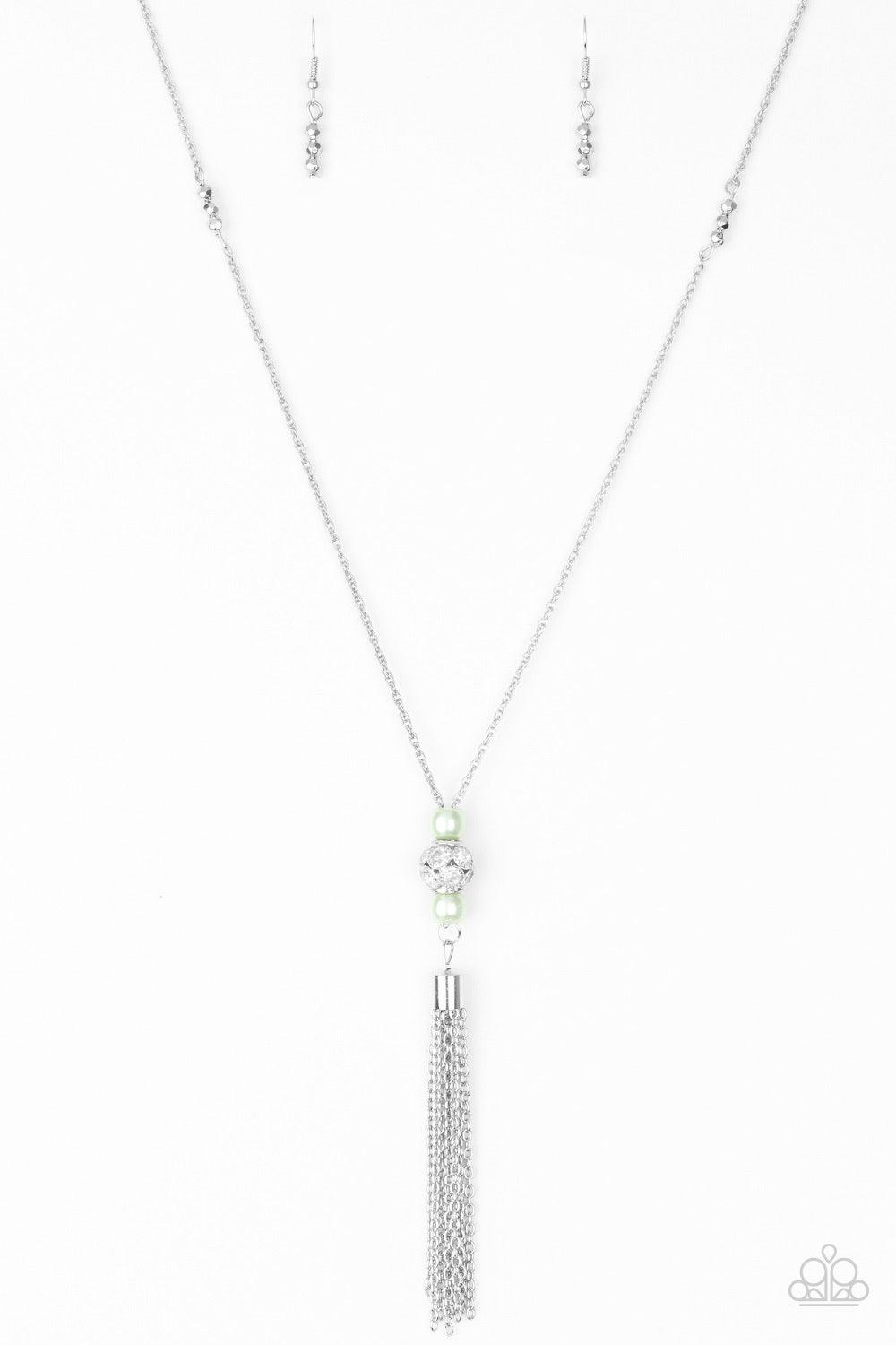 Paparazzi Accessories Century Shine - Green Infused with faceted silver accents, pearly green beads and a silver bead encrusted in glittery white rhinestones slide along a shimmery silver chain, creating an elegant centerpiece. A glistening silver tassel