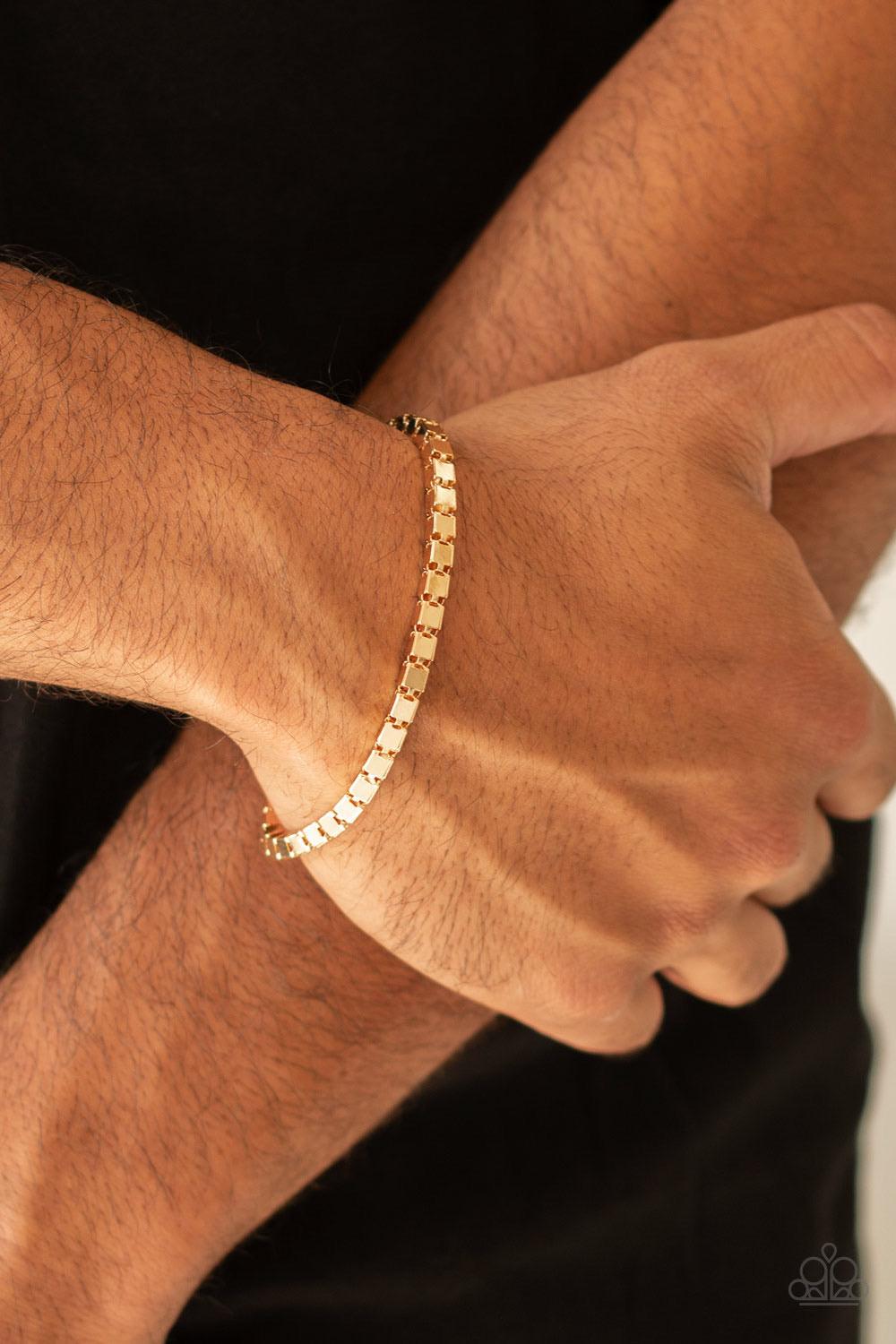 Paparazzi Accessories Boxing Champ - Gold A thick strand of glistening gold box chain links around the wrist for a bold look. Features an adjustable clasp closure. Sold as one individual bracelet. Jewelry