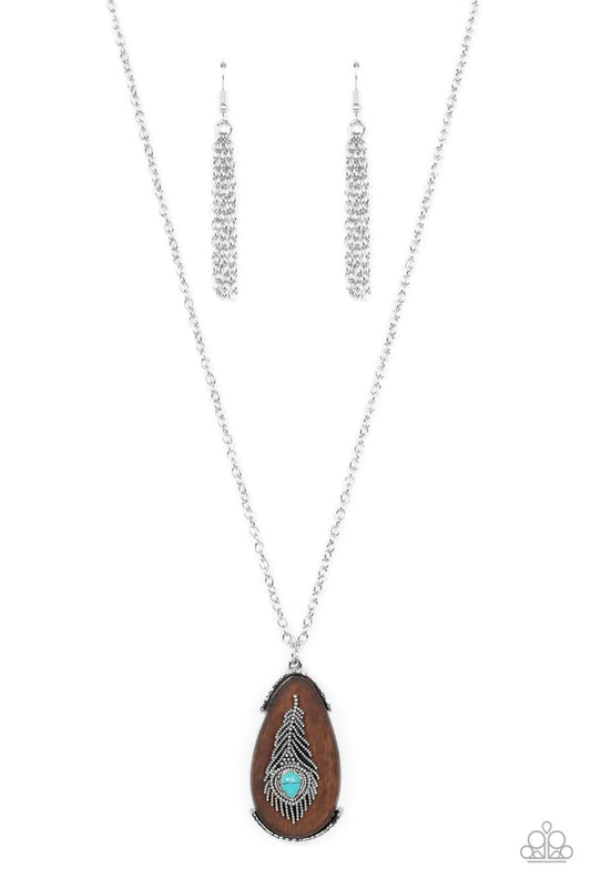 Paparazzi Accessories Personal FOWL - Blue A teardrop turquoise stone adorns a studded silver feather that embellishes an oversized wooden pendant at the bottom of an extended silver chain, resulting in a whimsically rustic pendant. Features an adjustable