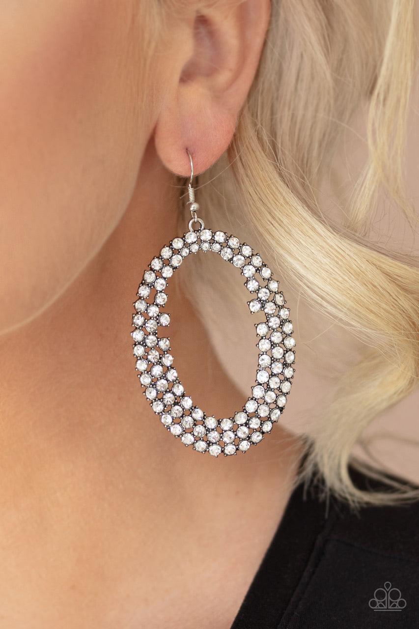 Paparazzi Accessories Radical Razzle - White Row after row of glittery white rhinestones encircle into an oversized hoop, creating a gritty glamorous look. Earring attaches to a standard fishhook fitting. Jewelry