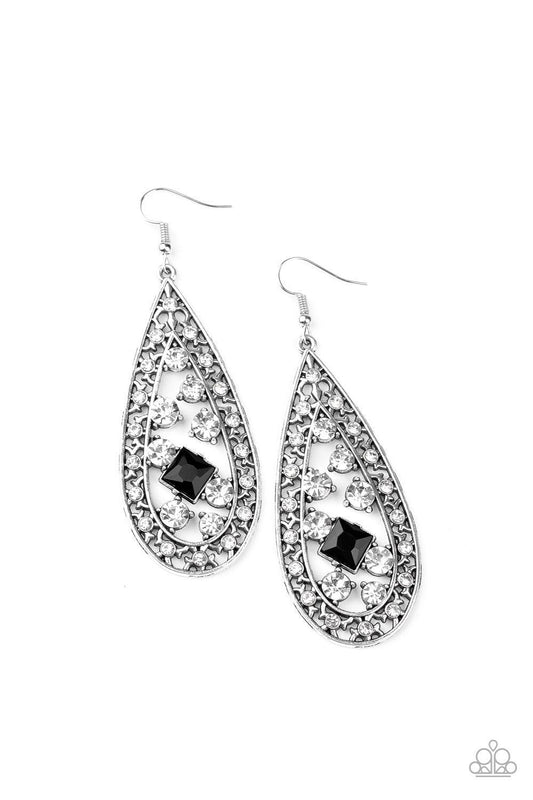 Paparazzi Accessories Drop-Dead Dazzle - Black A glassy collection of white rhinestones coalesce inside the center of a white rhinestone encrusted silver teardrop. Featuring a regal square cut, a glittery black rhinestone is added for a timeless twist. Ea