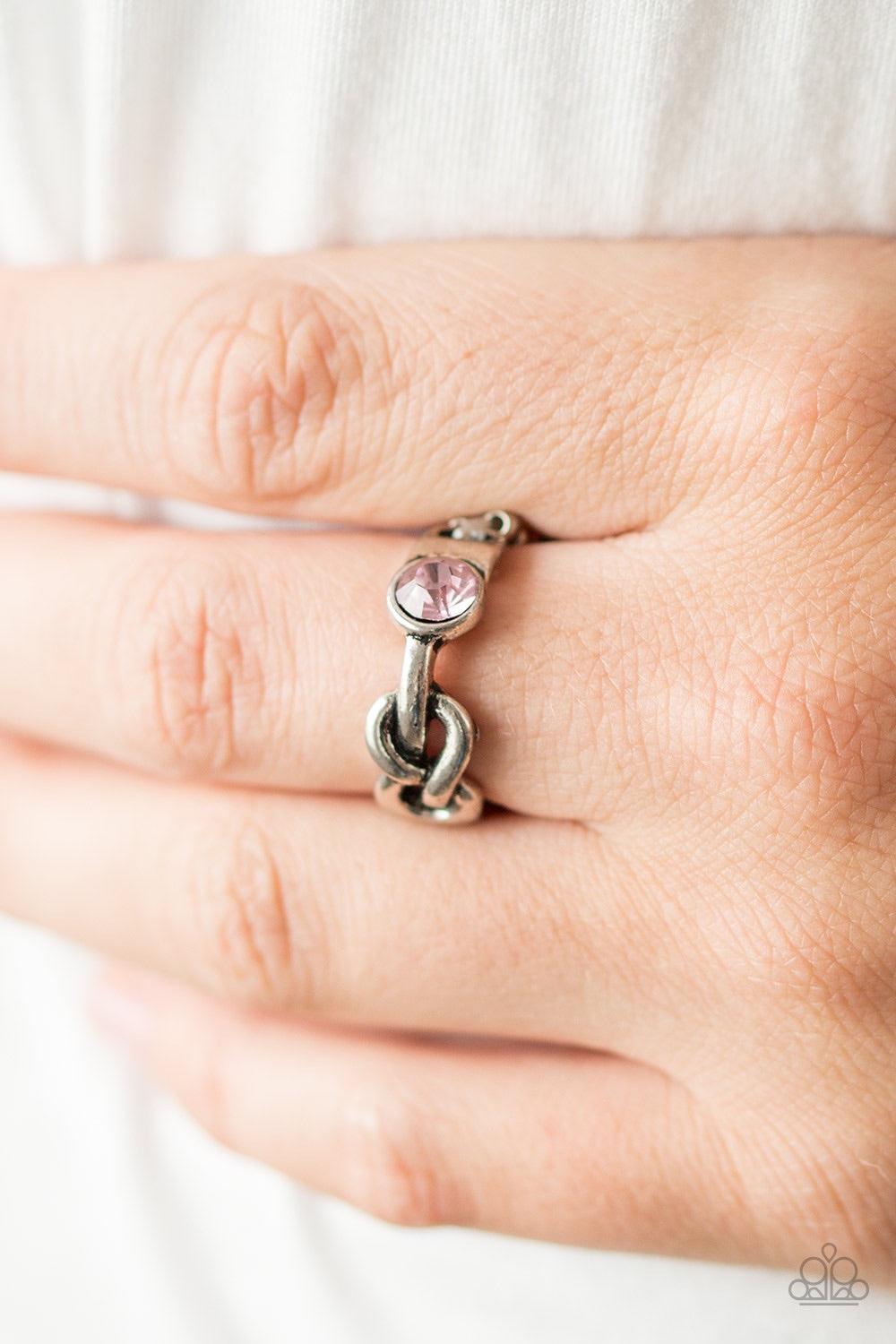 Paparazzi Accessories Infinite POSH-ibilities - Pink Dotted with a glittery pink rhinestone, a shiny silver bar loops into a whimsical infinity symbol across the finger, creating a dainty band. Features a dainty stretchy band for a flexible fit. Jewelry