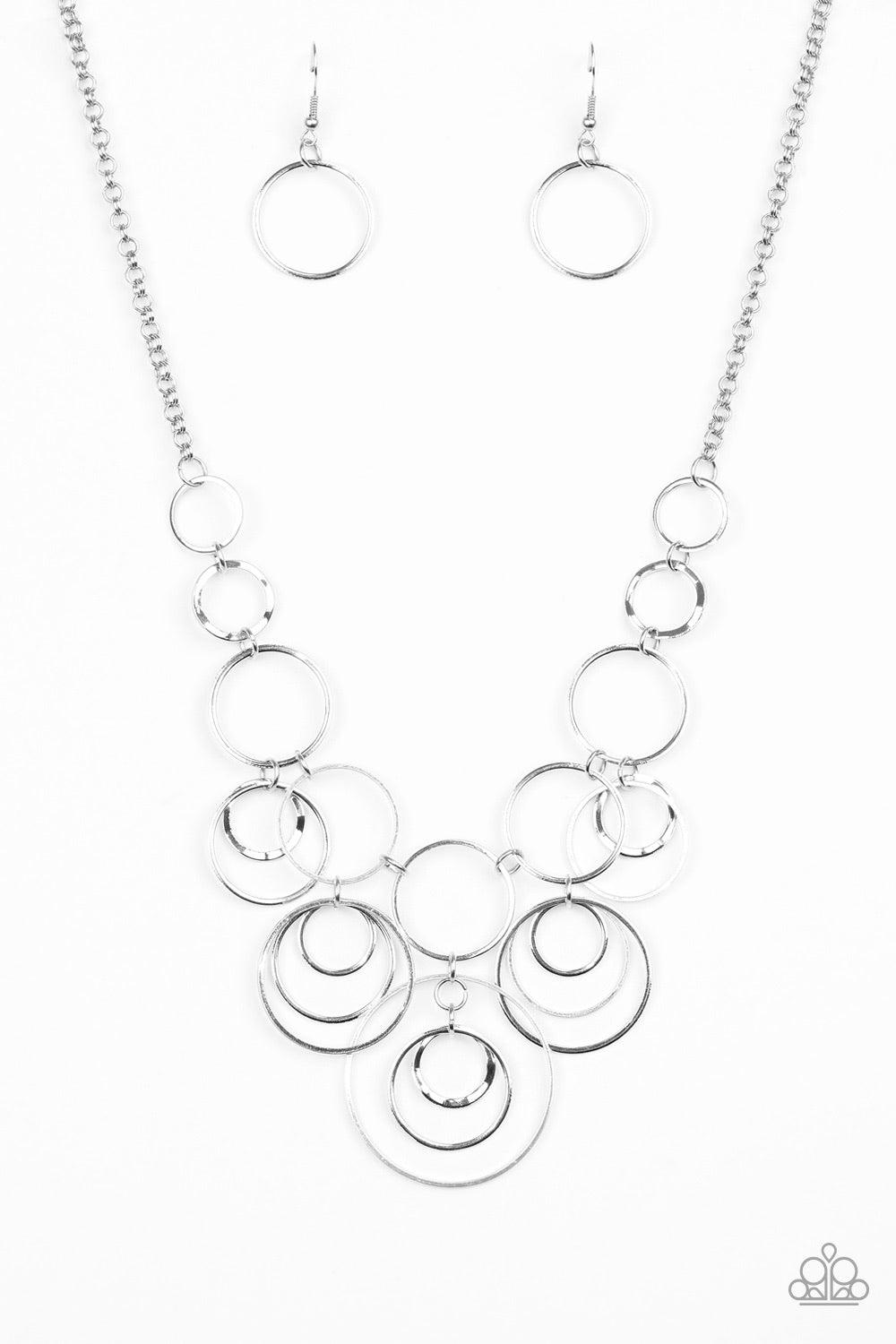 Paparazzi Accessories Break The Cycle - Silver Featuring smooth and delicately hammered finishes, mismatched silver hoops connect below the collar for a bold industrial look. Features an adjustable clasp closure. Jewelry