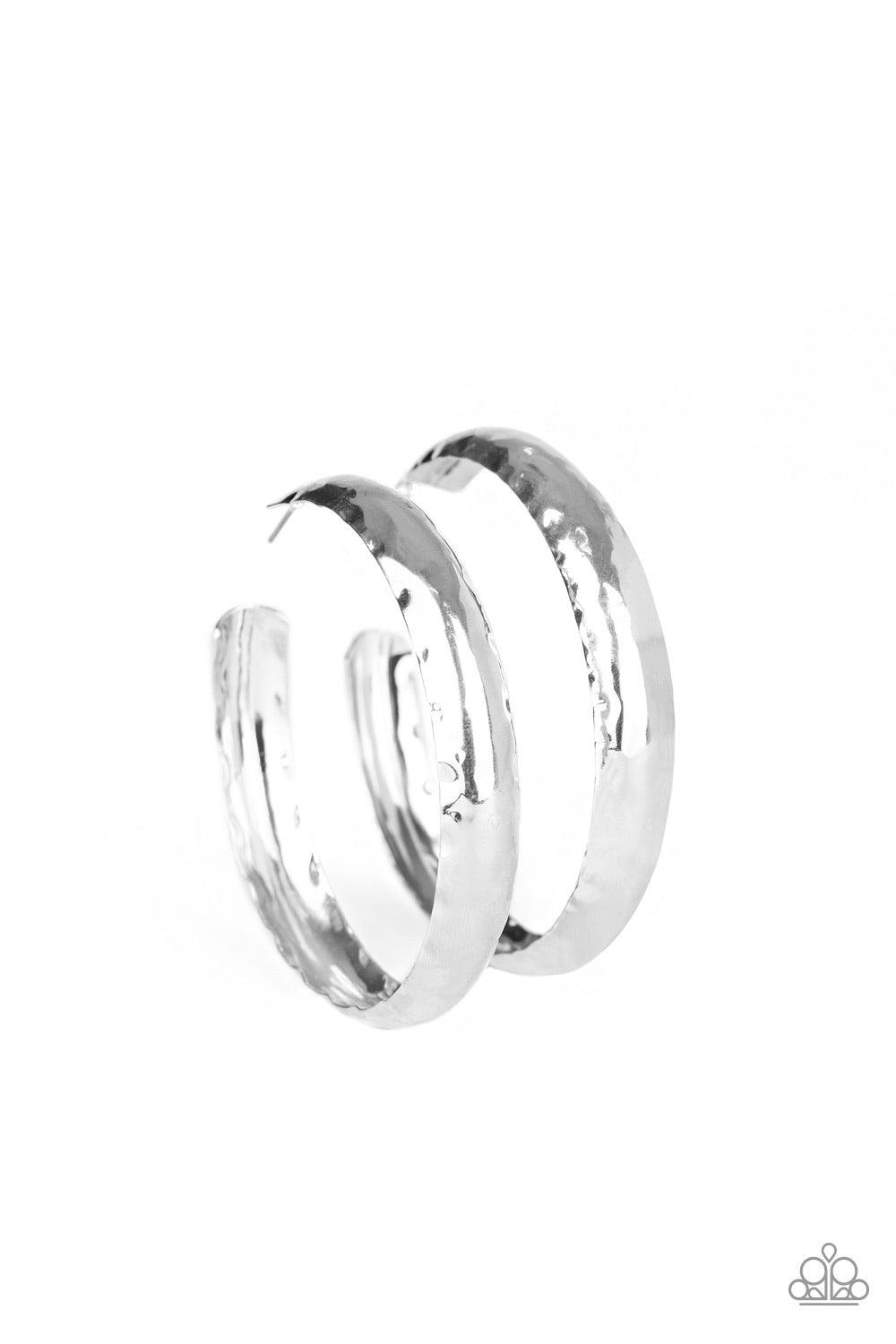 Paparazzi Accessories Check Out These Curves - Silver A thick piece of silver has been heavily hammered and delicately curved into a dramatically handcrafted hoop. Earring attaches to a standard post fitting. Hoop measures approximately 2 ½” in diameter J
