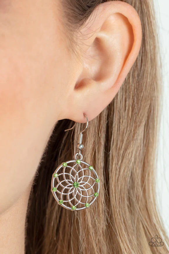 Paparazzi Accessories Springtime Salutations - Green Dotted with dainty green rhinestones, an airy mandala-like blossom blooms inside a silver hoop for a seasonal shimmer. Earring attaches to a standard fishhook fitting. Sold as one pair of earrings. Jewe
