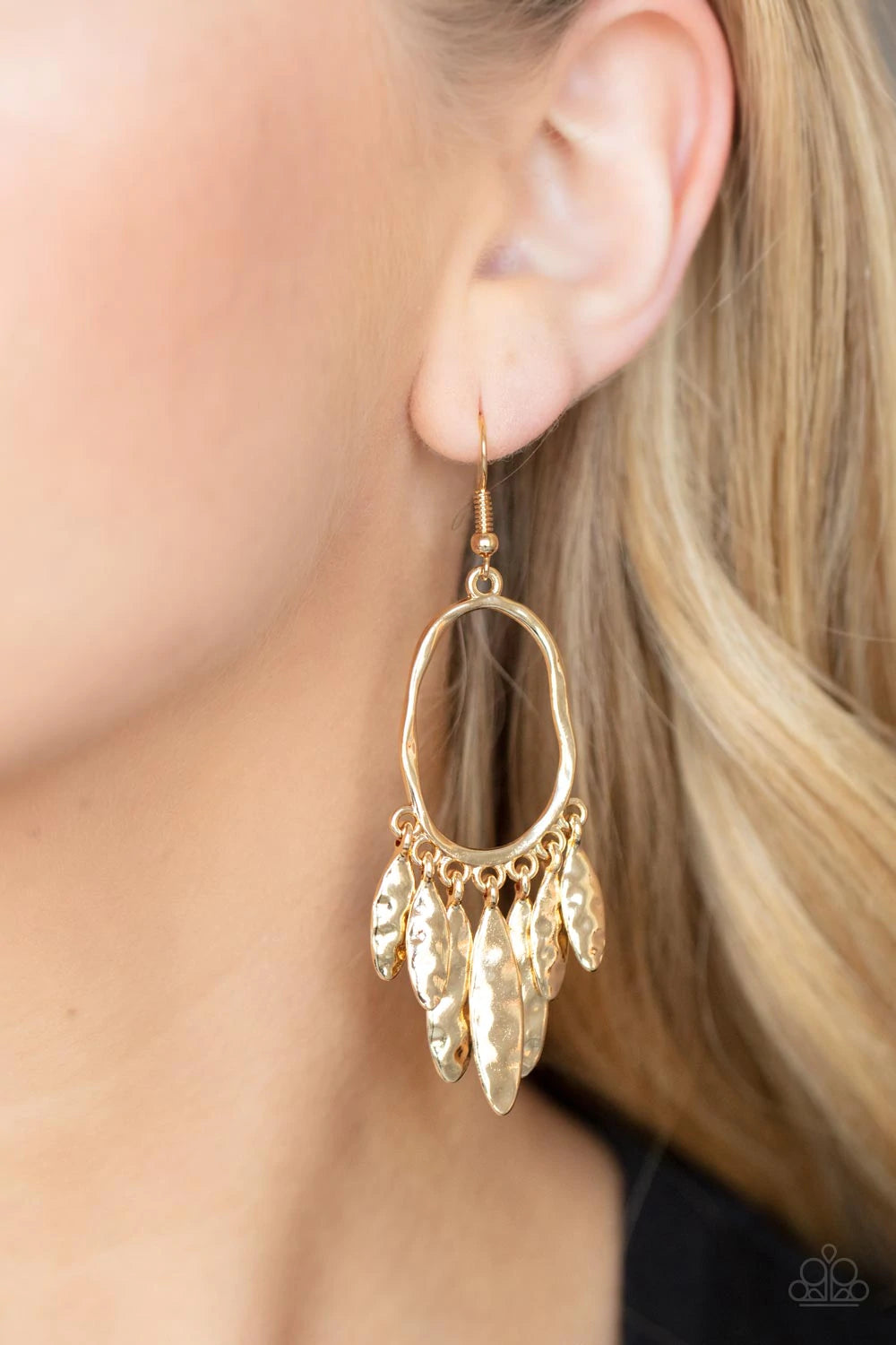 Paparazzi Accessories Artisan Aria - Gold A tapered fringe of hammered gold oval frames swing from the bottom of a hammered oval hoop, creating a musical fringe. Earring attaches to a standard fishhook fitting. Sold as one pair of earrings. Jewelry