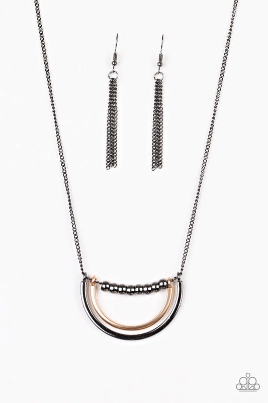 Paparazzi Accessories Artificial Arches - Black A strand of shiny gunmetal beads give way to bowing gold and gunmetal frames, creating an edgy pendant below the collar. Features an adjustable clasp closure. Sold as one individual necklace. Includes one pa