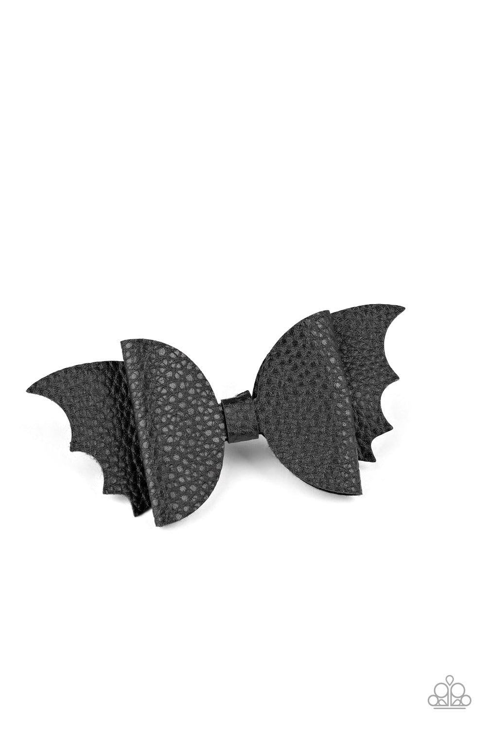 Paparazzi Accessories Drive Them Batty! - Black Featuring scalloped edges, a piece of black leather delicately knots into a spooky bat-like bow. Features a standard hair clip on the back. Sold as one individual hair clip. Jewelry