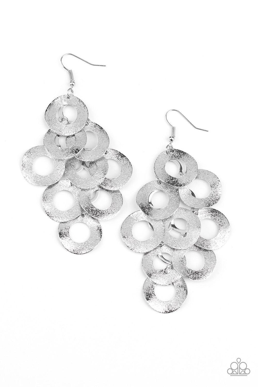 Paparazzi Accessories Scattered Shimmer - Silver Delicately hammered in light-catching shimmer, rows of curved silver hoops delicately overlap into a noise-making lure. Earring attaches to a standard fishhook fitting. Sold as one pair of earrings. Jewelry