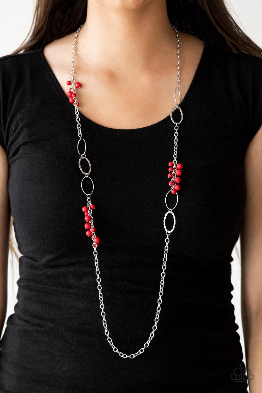 Paparazzi Accessories Flirty Foxtrot - Red Smooth and hammered silver rings join clusters of fiery red beads along a shimmery silver chain for a colorful look. Features an adjustable clasp closure. Sold as one individual necklace. Includes one pair of mat