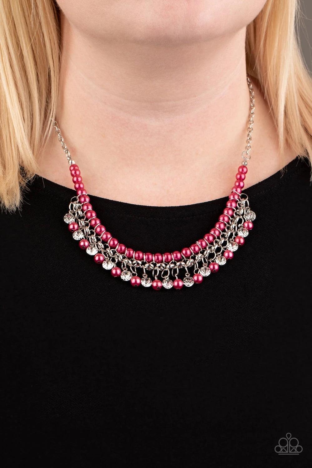 Paparazzi Accessories A Touch of CLASSY - Pink Infused with silver chain, vivacious pink pearls are threaded along an invisible wire below the collar. Matching pink pearls and glittery white rhinestones swing from the pearly strand, creating a flirtatious