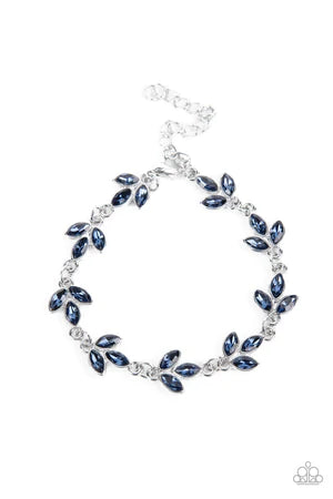 Paparazzi Accessories Gala Garlands - Blue Twinkling trios of marquise cut blue rhinestones gather into leafy frames as they delicately link around the wrist, resulting in a radiant centerpiece. Features an adjustable clasp closure. Sold as one individual
