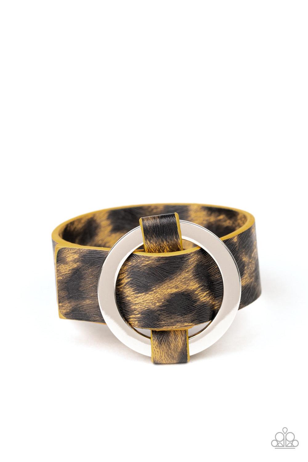 Paparazzi Accessories Jungle Cat Couture - Yellow Featuring a shiny yellow cheetah pattern, a textured piece of leather loops through the center of a shimmery silver hoop for a sassy urban look. Features an adjustable belt loop closure. Jewelry