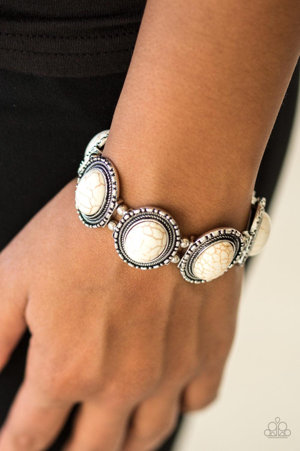 Paparazzi Accessories RANCH Out - White Smooth white stones are pressed into antiqued silver frames. Threaded along stretchy elastic bands, the earthy frames link around the wrist in a seasonal southwestern fashion. Sold as one individual bracelet. Jewelr