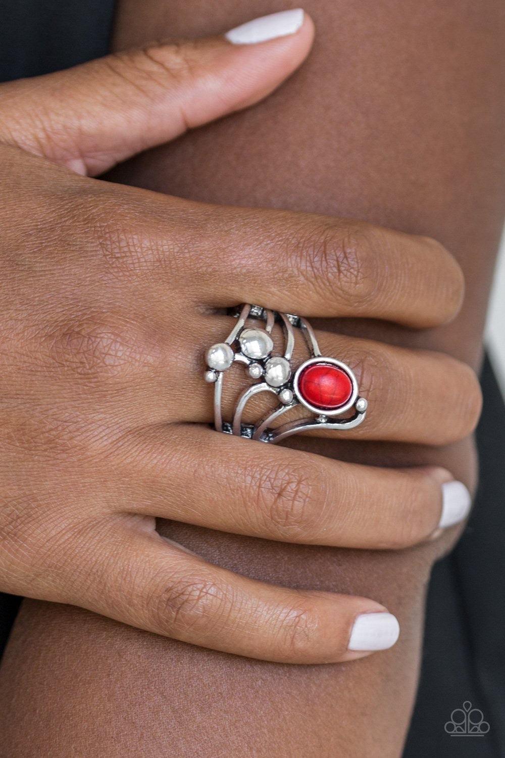 Paparazzi Accessories Wanderlust Wanderer ~Red Dotted with bubbly silver frames, glistening silver bars swoop across the finger. A fiery red stone is pressed into the top of the whimsically stacked frame for a seasonal finish. Features a stretchy band for