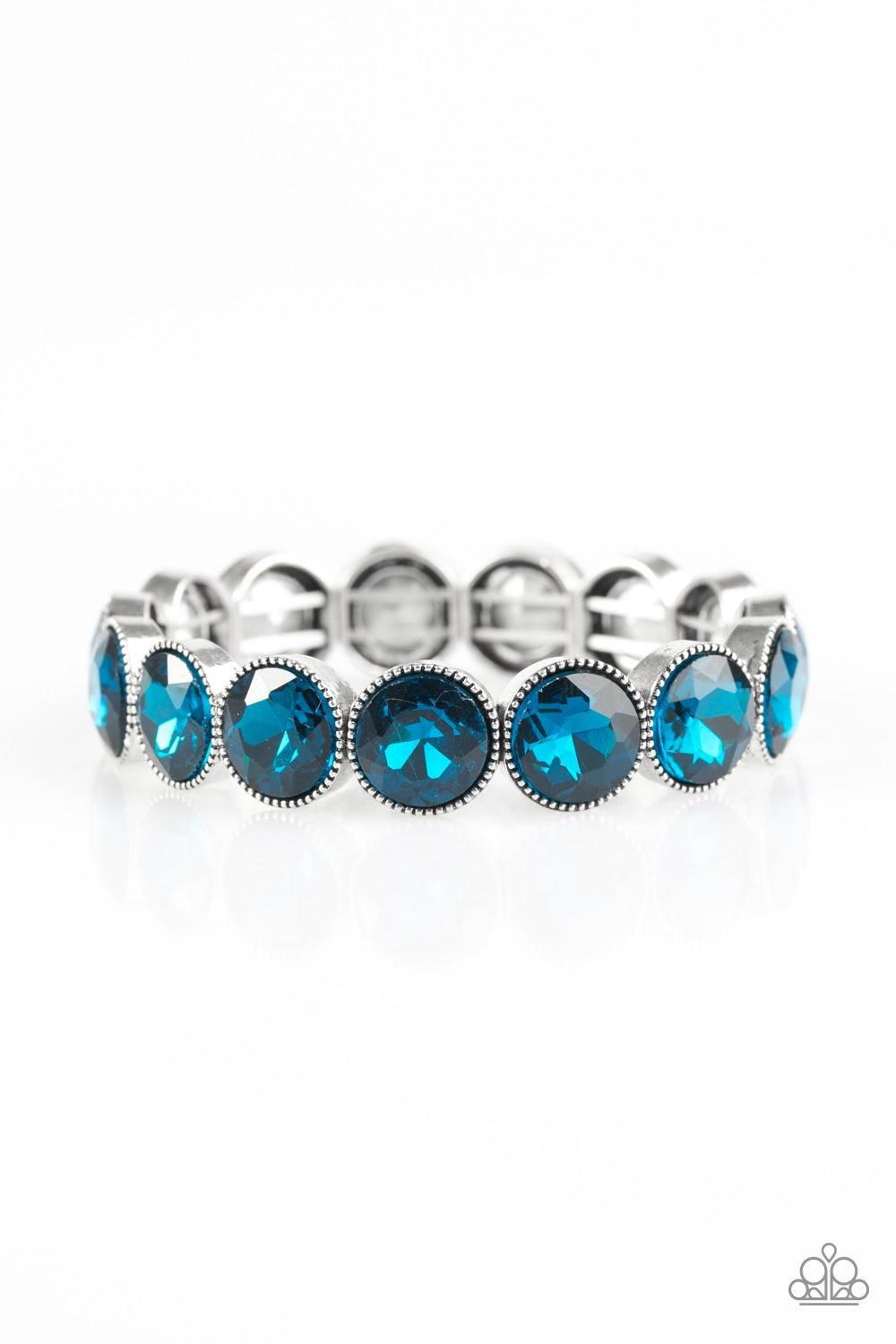 Paparazzi Accessories Number One Knockout - Blue Faceted blue gems are pressed into sleek silver frames. The glittery frames are threaded along elastic stretchy bands, creating a glamorous look around the wrist. Jewelry