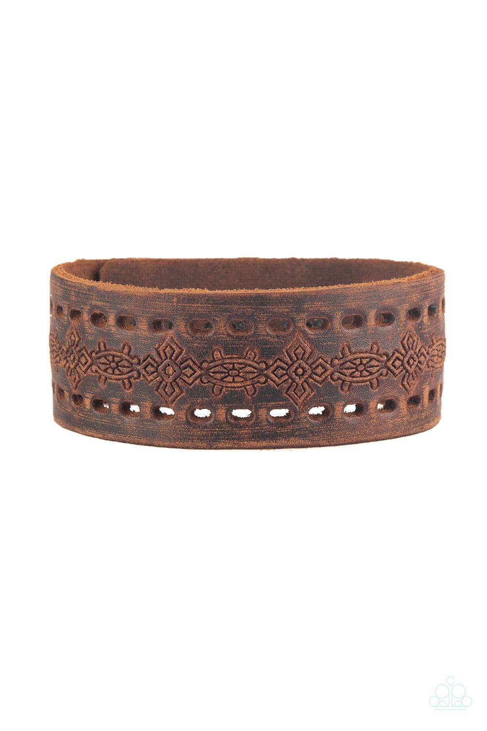 Paparazzi Accessories Make The WEST of It - Brown Stamped in a southwestern textile inspired pattern, a distressed brown leather band wraps around the wrist for a seasonal look. Features an adjustable snap closure. Jewelry