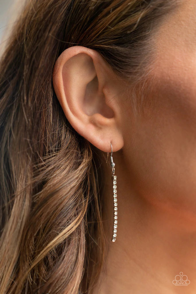 Paparazzi Accessories Impressively Icy - White A twisted chain of glassy rhinestones elegantly drip along a classic silver chain across the chest. Features an adjustable clasp closure. Sold as one individual necklace. Includes one pair of matching earring