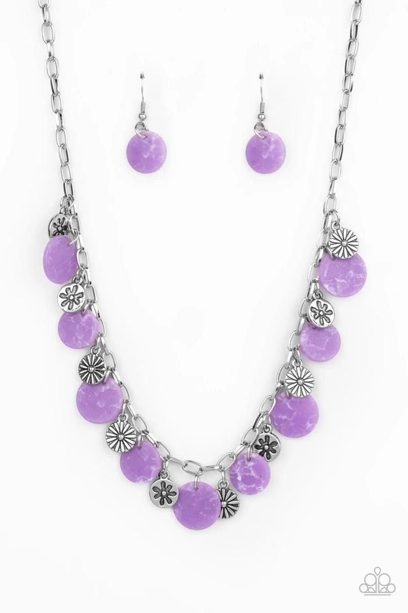 Paparazzi Accessories Flower Powered ~Purple A whimsical collection of mismatched silver floral charms and purple acrylic discs swing from a silver chain, creating a vivacious fringe below the collar. Features an adjustable clasp closure. Sold as one indi