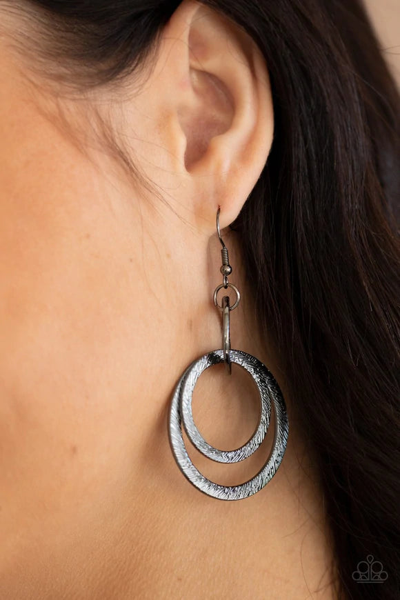 Paparazzi Accessories Distractingly Dizzy - Black Etched and embossed in shimmery textures, a trio of glistening gunmetal hoops interlock into a dizzying lure. Earring attaches to a standard fishhook fitting. Sold as one pair of earrings. Earrings