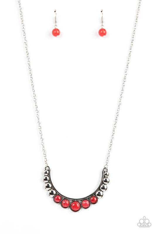 Paparazzi Accessories Horseshoe Bend - Red Flat silver beads fade into cloudy red stone beads as they bow into a half moon at the bottom of a curved silver bar, creating an ethereal pop of color at the bottom of an extended silver chain. Features an adjus