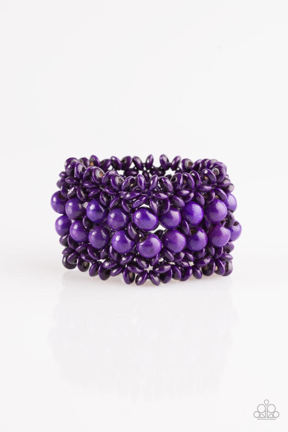 Paparazzi Accessories Tropical Bliss - Purple Purple wooden accents are threaded along elastic stretchy bands, creating an ornate bracelet. Rounded purple wooden beads line the center of the summery pattern for a bold finish. Jewelry